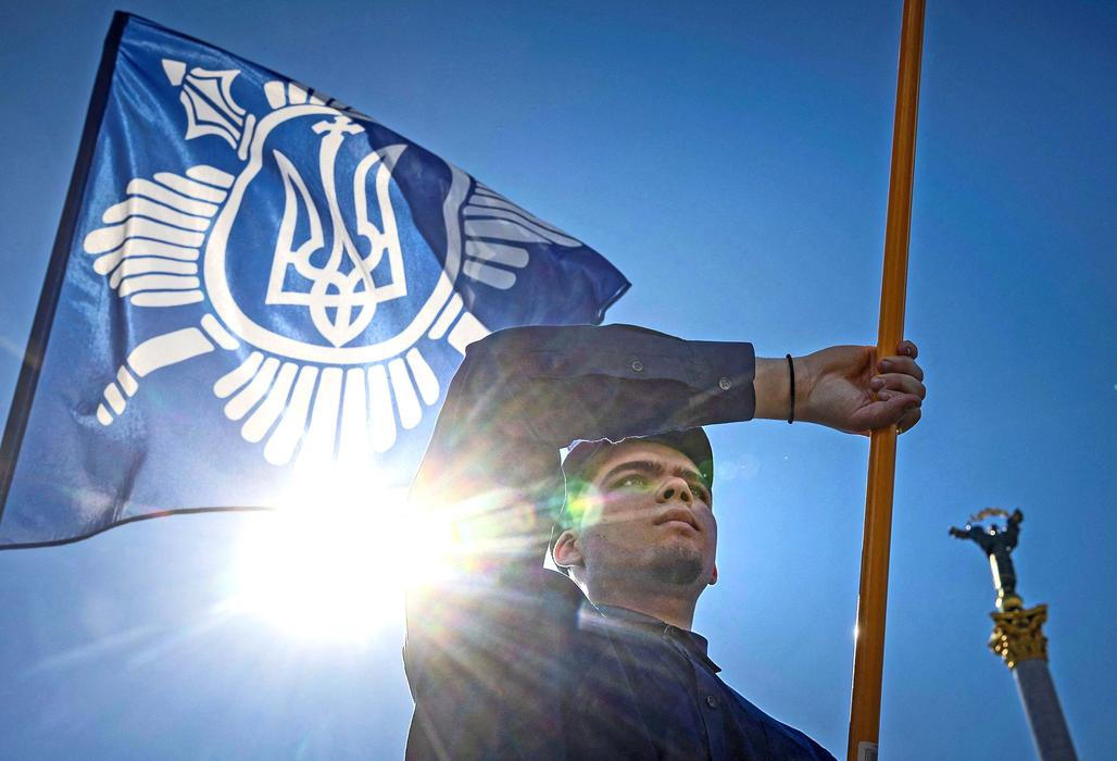 Protesters march denouncing an LGBT+ event in Kyiv