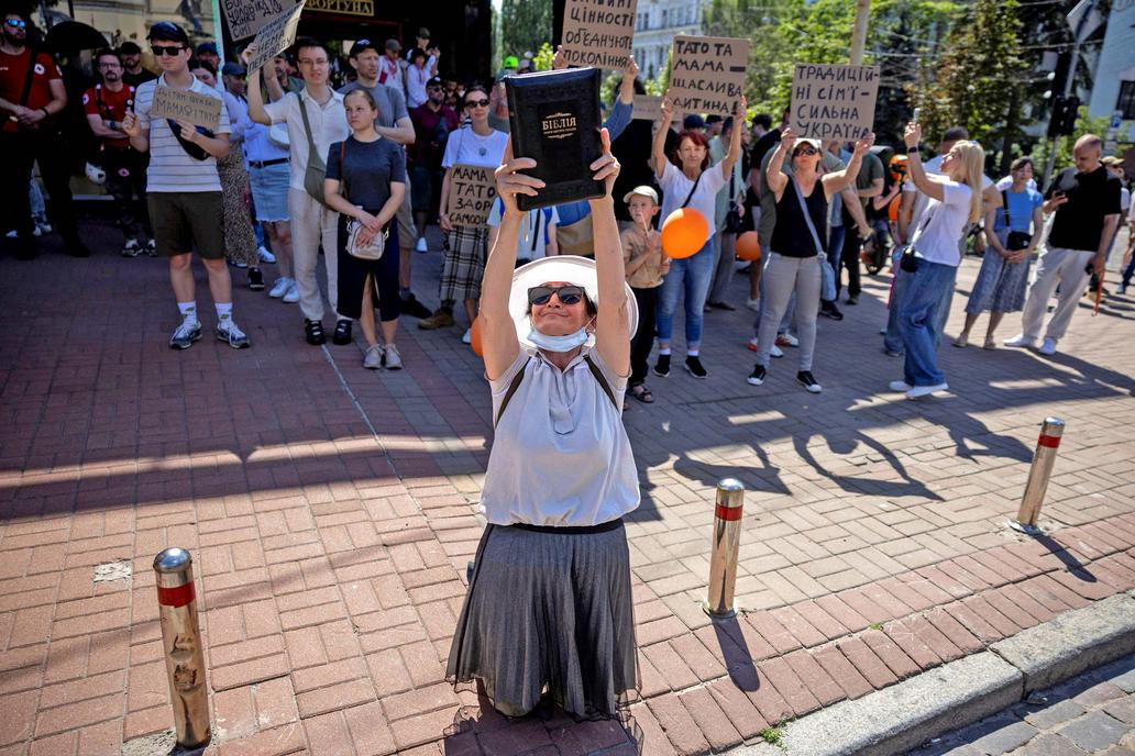Protesters march denouncing an LGBT+ event in Kyiv