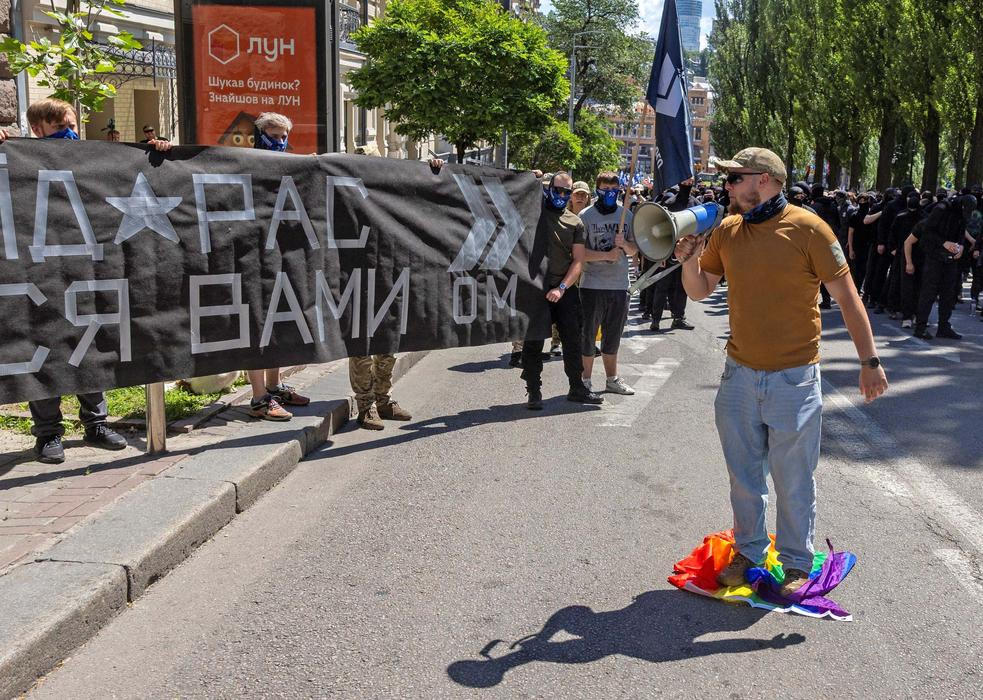 Protesters march denouncing an LGBT+ event in Kyiv