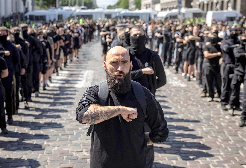 Protesters march denouncing an LGBT+ event in Kyiv