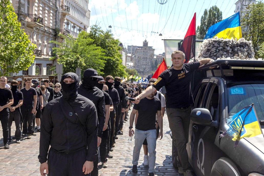 Protesters march denouncing an LGBT+ event in Kyiv