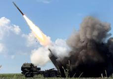 Ukrainian servicemen fire a High Mobility Artillery Rocket System (HIMARS) towards Russian troops near the frontline in Donetsk region