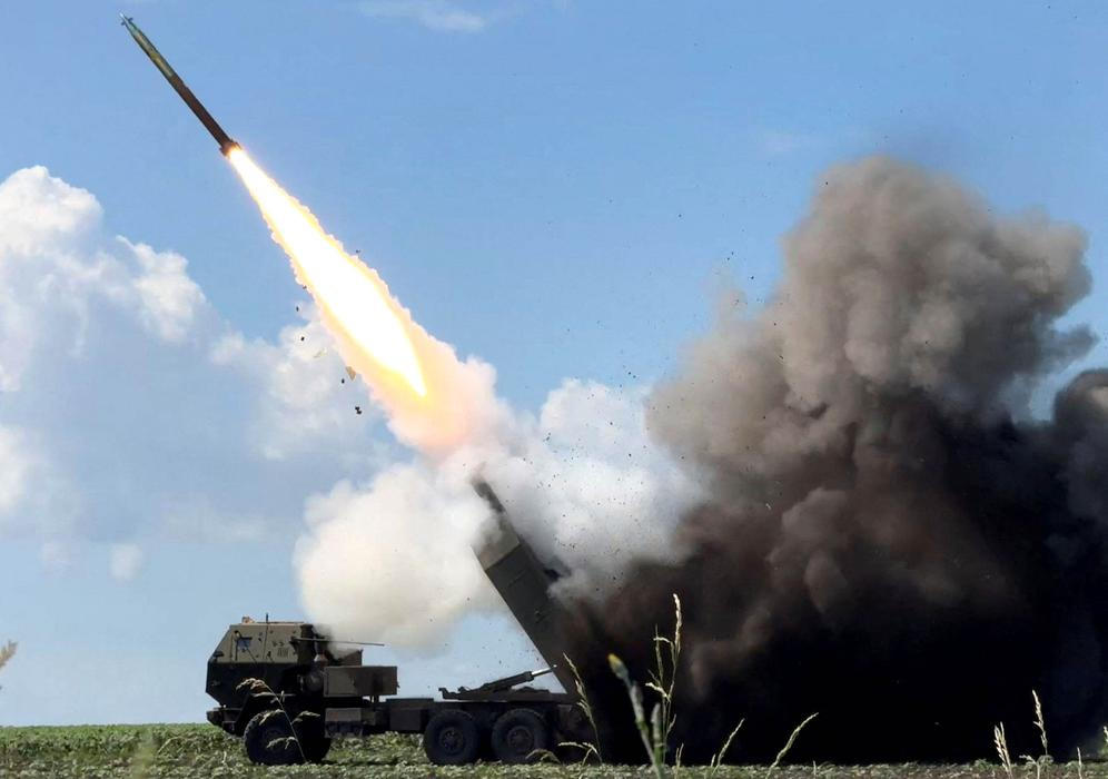Ukrainian servicemen fire a High Mobility Artillery Rocket System (HIMARS) towards Russian troops near the frontline in Donetsk region