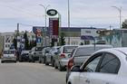 FILE PHOTO: Cars queue for fuel at a gas station in Sevastopol