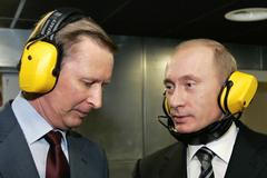 FILE PHOTO: Russian President Putin and Defence Minister Ivanov talk at a shooting gallery in Moscow