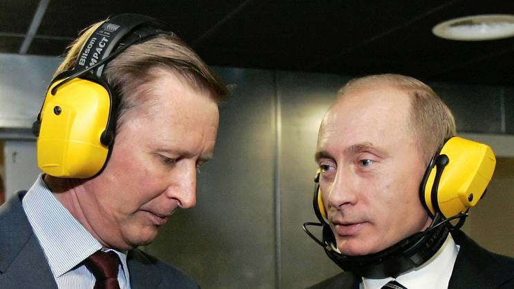 FILE PHOTO: Russian President Putin and Defence Minister Ivanov talk at a shooting gallery in Moscow