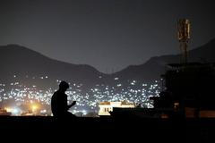 FILE PHOTO: A man on a video call in Kabul, Afghanistan,