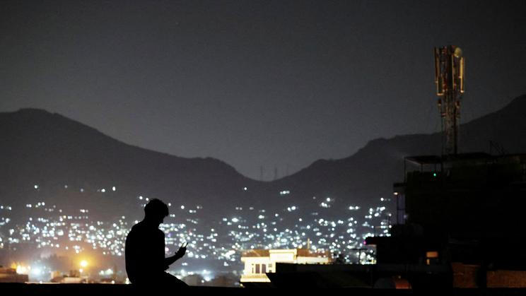 FILE PHOTO: A man on a video call in Kabul, Afghanistan,