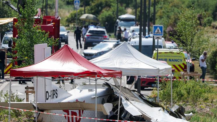 French rescuers work at the site of a plane crash, in Tomblaine