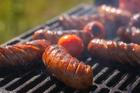 Hot,Grilled,Sausages,On,Barbecue,Grill,With,Smoke,