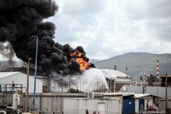 A blaze after Israel's Fire and Rescue Service said that an industrial building and a fuel tanker at Israel's Oil Refineries were hit by debris from an intercepted Iranian missile, in Haifa