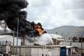 A blaze after Israel's Fire and Rescue Service said that an industrial building and a fuel tanker at Israel's Oil Refineries were hit by debris from an intercepted Iranian missile, in Haifa
