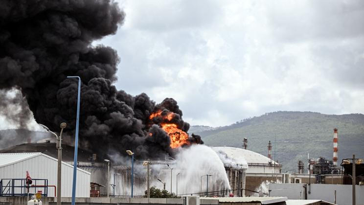 A blaze after Israel's Fire and Rescue Service said that an industrial building and a fuel tanker at Israel's Oil Refineries were hit by debris from an intercepted Iranian missile, in Haifa