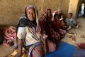 FILE PHOTO: Displaced women from South Kordofan sit on the ground in El Obeid, North Kordofan State