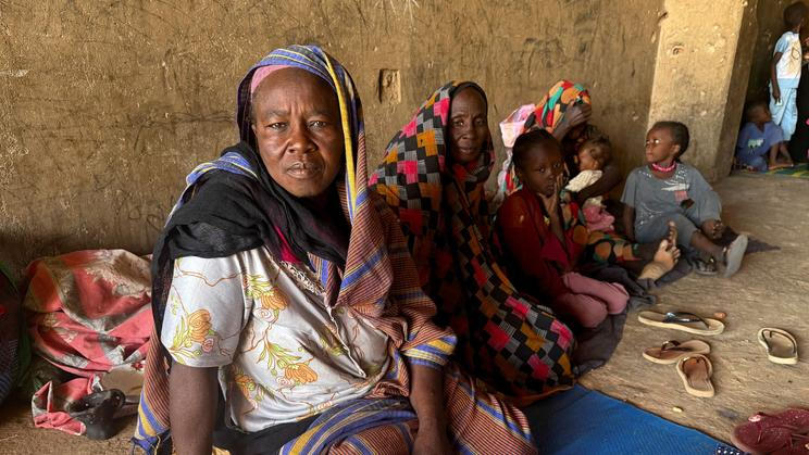 FILE PHOTO: Displaced women from South Kordofan sit on the ground in El Obeid, North Kordofan State