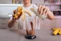 Man,Adding,Milk,And,Peeled,Banana,To,Blender,With,Chocolate