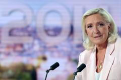 French far-right leader Le Pen reacts on TV after the verdict in her appeal trial over misuse of EU funds