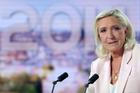 French far-right leader Le Pen reacts on TV after the verdict in her appeal trial over misuse of EU funds