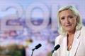 French far-right leader Le Pen reacts on TV after the verdict in her appeal trial over misuse of EU funds