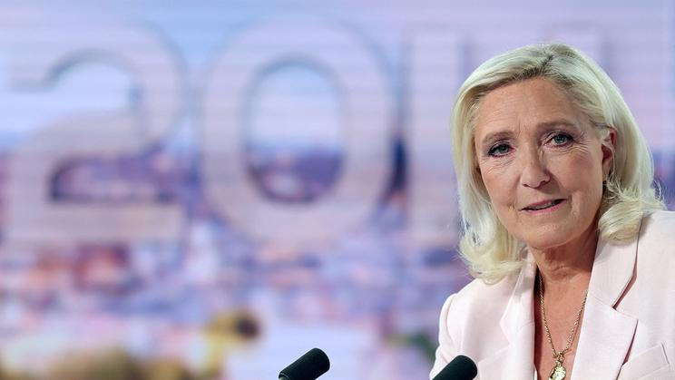 French far-right leader Le Pen reacts on TV after the verdict in her appeal trial over misuse of EU funds