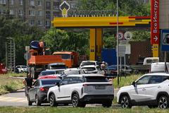 FILE PHOTO: Cars queue to refuel at a petrol station in Rostov-on-Don