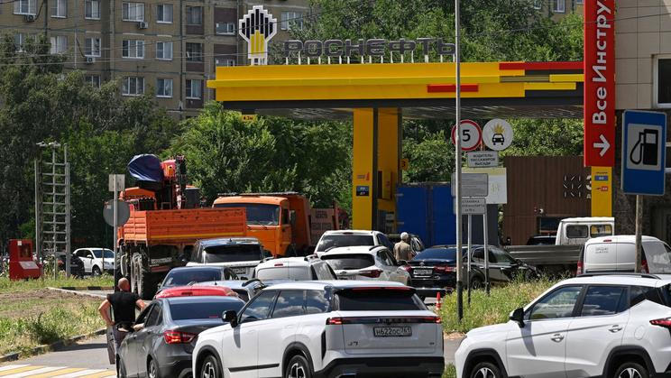 FILE PHOTO: Cars queue to refuel at a petrol station in Rostov-on-Don