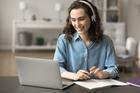 Beautiful,Student,Girl,In,Headphones,Watching,Educational,Videos,On,Internet,
