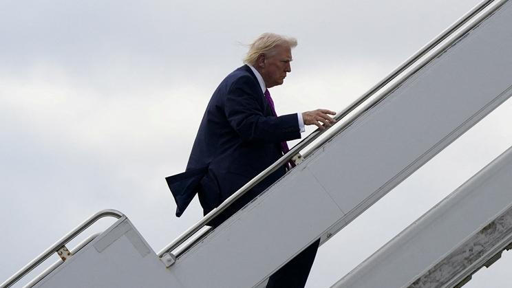 FILE PHOTO: U.S. President Donald Trump boards Air Force One at Palm Beach International Airport in West Palm Beach