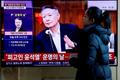 FILE PHOTO: People watch a news report on the sentencing trial of South Korean former president Yoon Suk Yeol's insurrection case in Seoul