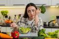 Young,Woman,Eats,Vegetable,Salad,And,Looks,Drained,After,Strict