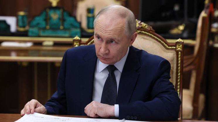 Russian President Vladimir Putin attends a meeting with Russian Export Centre Director General Veronika Nikishina in Moscow