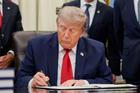 U.S. President Donald Trump signs an executive order in the Oval Office at the White House in Washington