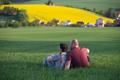 Happy,Couple,Enjoying,Spring,Rural,Landscape,Of,Nature,With,Green