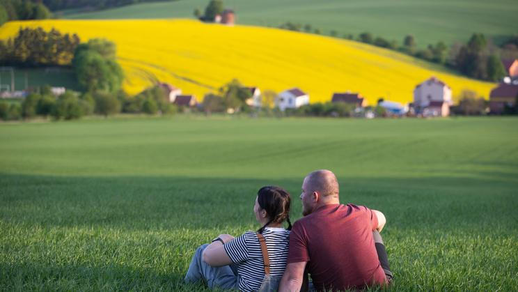 Happy,Couple,Enjoying,Spring,Rural,Landscape,Of,Nature,With,Green