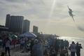 A Navy Blue Angels jet flies low over the crowd on Pensacola Beach