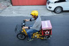 Harbin,,China,-,June,23,,2019:,Food,Delivery,Man,Driving