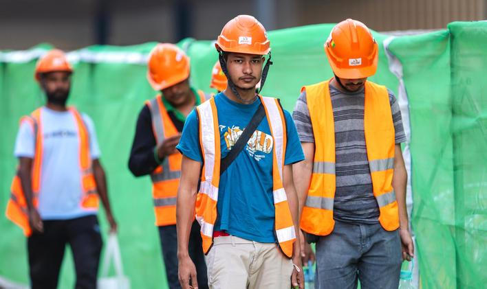 Kuala,Lumpur,,Malaysia,-,July,27,,2024:,Foreign,Workers,Wearing