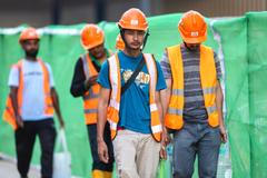 Kuala,Lumpur,,Malaysia,-,July,27,,2024:,Foreign,Workers,Wearing