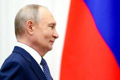 Russian President Vladimir Putin attends a ceremony to present state decorations to parents of large families in Moscow