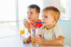 Cute,Children,Drinking,Soda,Or,Soft,Drink,With,Straw,In