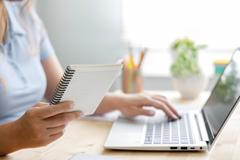 Freelancer,Woman,Using,Laptop,Computer,At,Home.,She,Is,Changing