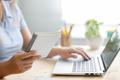 Freelancer,Woman,Using,Laptop,Computer,At,Home.,She,Is,Changing