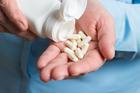 Woman,Hand,Holds,White,Medication,Capsules,Of,Glucosamine,,Pours,From