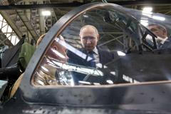 Russian President Vladimir Putin visits an aviation plant in Irkutsk