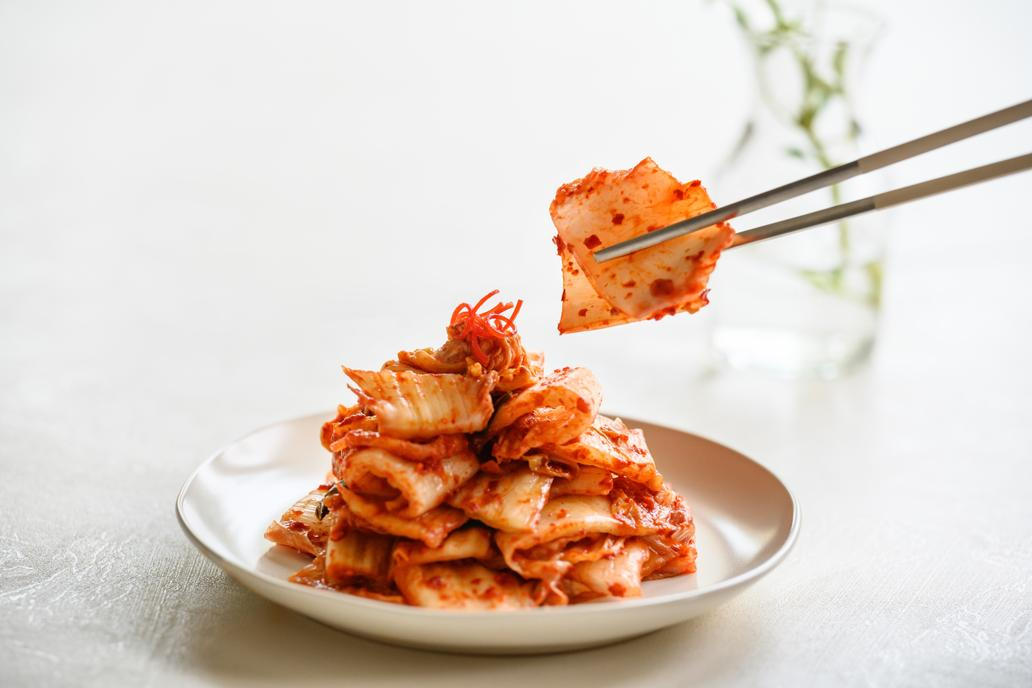 A,Person,Is,Picking,Up,Cabbage,Kimchi,,A,Traditional,Korean