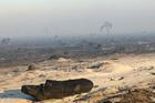 Smoke and fog in a burnt forest affected by a wildfire, near Saumos