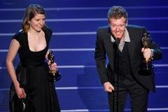 FILE PHOTO: Glen Hansard and Marketa Irglova accept the Oscar for the best original song "Falling Slowly" during the 80th annual Academy Awards in Hollywood