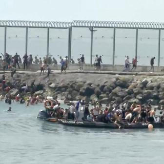 Migrants swim to Spain's Ceuta in mass border crossing