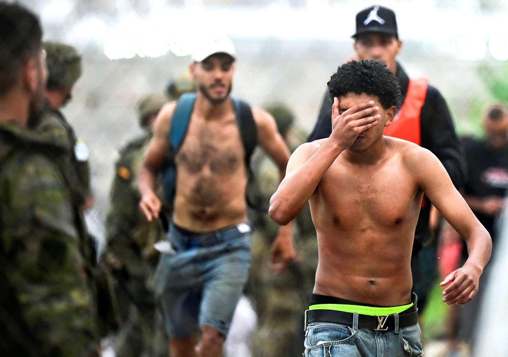 Migrants from Morocco arrive at the Spanish border in Ceuta