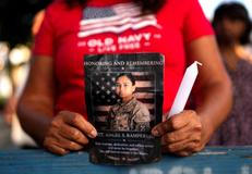 People attend a vigil for fallen U.S. soldier Sgt. Rampersad in the Queens Borough of New York City